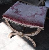 A 19th Century dressing stool with red floral upholstered seat and gilt decoration,