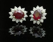 A pair of 9 carat ruby and diamond stud earrings