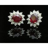 A pair of 9 carat ruby and diamond stud earrings