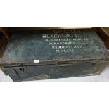 A painted tin trunk inscribed "CPT. D.