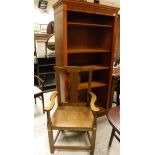 A modern open bookcase and an oak framed carver chair in the Georgian manner