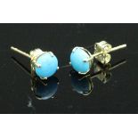 A pair of turquoise ear studs