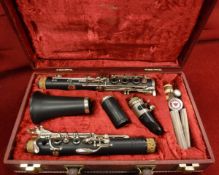 A Yamaha YFL211S flute in case, a Graduate clarinet in a case by Rudall Carte,