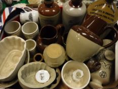 A small quantity of various stone ware flagons to include flagon marked "Foster & Son,