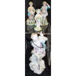 Four assorted Chelsea/Derby type figures to include lady holding small bird aloft,
