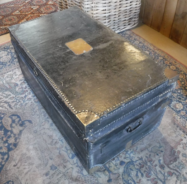 An 18th Century black leather and brass studded trunk