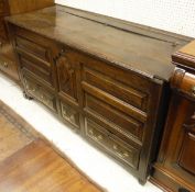 An 18th Century North Country oak mule chest the plank top with moulded front edge above the five