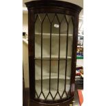 A 19th Century mahogany bow front wall hanging corner display cabinet with Greek key moulding