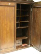 A collection of furniture comprising a mahogany two door cupboard with pigeon hole interior,