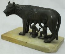 A 19th Century Italian bronze figural group of Romulus and Remus suckling from the she-wolf,