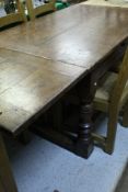A modern oak drawer leaf refectory style table in the circa 1700 manner,