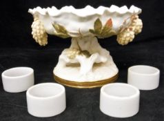 A Moore tazza with white ground decorated with applied leaves and fruits decoration,