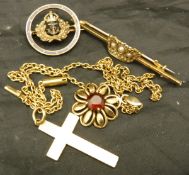 A quantity of 18 carat gold jewellery into include crucifix, brooch with pearl crown decoration,