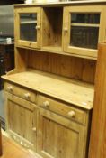 A modern pine dresser of small proportions,