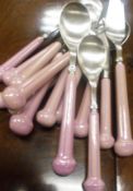 A box containing a Denby "Regency" pink cutlery set,