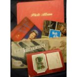 An album of cigarette cards including regimental symbols, famous sportsmen, bicycles, film stars,