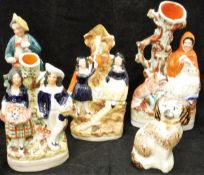 Four various Staffordshire flat back figures and spill vases,