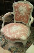 A 19th Century salon arm chair in the Louis XV manner with pink floral upholstery