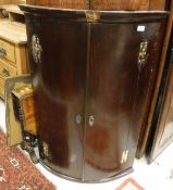 A 19th Century mahogany bow fronted corner cabinet,