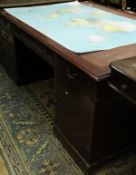 A mahogany partner's desk,