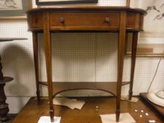 An Edwardian mahogany and satinwood strung breakfront single drawer side table,