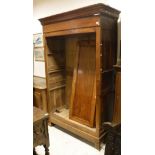 A 19th Century French fruitwood armoire with moulded cornice over two rectangular panelled cupboard
