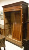 A 19th Century French fruitwood armoire with moulded cornice over two rectangular panelled cupboard
