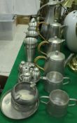 A collection of Selangor pewter wares to include teapot, coffee pot, hot water pot, various beakers,