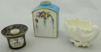 A Coalport style inkwell in cobalt blue with gilt decoration and armorial to the side,