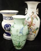 A Chinese celadon vase decorated with bird in flight amongst flowers,