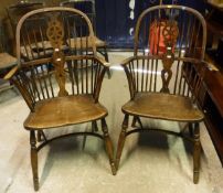 Two circa 1900 Thames Valley wheel and stick back elbow chairs on turned legs each united by