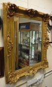 A rectangular wall mirror in carved gilded frame CONDITION REPORTS Lench 110 cm x