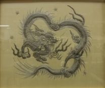 A Chinese needlework of a four toed dragon CONDITION REPORTS Some slight dirty marks.