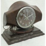 A mahogany cased mantle clock, the body as the central section of a propeller and inscribed "DRG.NO.