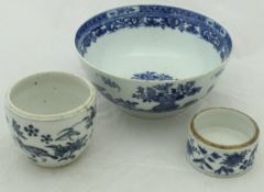 A Chinese bowl with white ground decorated with a central floral spray,