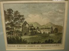 A box of various prints and paintings to include "Valle Crucis Abbey in Denbighshire" hand tinted,