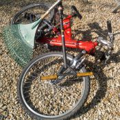 A Flymo lawn mower, garden rake, a child's Raleigh MX aluminium bike,