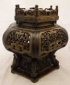 A 19th Century Chinese vase stand in Eastern hardwood with pierced and carved decoration,