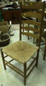 A set of ten modern rush seated ladder back dining chairs by Alan Davies of Hartbury
