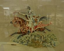 A 19th Century needlework of a horseman on horseback going over a fence"