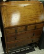 A mid 20th Century mahogany bureau, the fall front over two short and two long drawers,