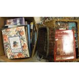 A small wicker hamper and one box containing various reference books on interior design,