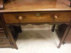 A 19th Century mahogany single drawer side table on square section supports,