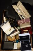 A box of miscellaneous items to include penknife, cufflinks, pin badges,