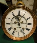 A wall clock with associated movement with Roman numerals,