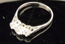 A platinum three stone diamond ring, approx 0.