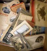 A box of assorted postcards,