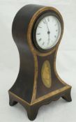 A circa 1900 mahogany banded and inlaid balloon shaped mantle clock with Roman numerals to the