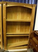 A modern pine adjustable bookcase with dentil decoration to cornice