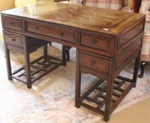 An early 20th Century Chinese rosewood pedestal desk,